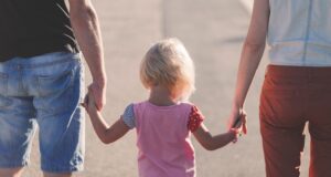 parents-holding-hands-of-childre